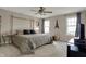 Comfortable bedroom features a four-poster bed, ceiling fan, and ample natural light at 2627 Congress St, Carmel, IN 46032