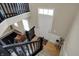 Bright entryway with staircase, hardwood floors, and a view to the comfortable sitting area at 2627 Congress St, Carmel, IN 46032