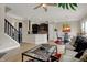 Open-concept living room and kitchen area featuring wood floors and a modern design at 2627 Congress St, Carmel, IN 46032