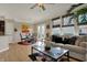 Spacious living room featuring wood floors, an open layout, and large windows for natural light at 2627 Congress St, Carmel, IN 46032