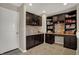 Spacious home office featuring custom cabinetry, desk space, and tile flooring at 2627 Congress St, Carmel, IN 46032