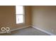 Bedroom featuring natural light from a window, neutral walls, and wood floors at 2811 S Elm St, Muncie, IN 47302