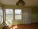 Dining area with hardwood floors and natural lighting at 2811 S Elm St, Muncie, IN 47302