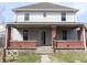 Charming two-story home featuring a covered front porch and classic architectural details at 2811 S Elm St, Muncie, IN 47302