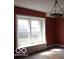 Bright room with a large window and unique chandelier at 2811 S Elm St, Muncie, IN 47302