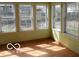 Sunroom featuring large windows and hardwood floors at 2811 S Elm St, Muncie, IN 47302