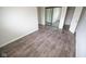 Bedroom showcases vinyl floors, light gray walls, and sliding closet doors at 2862 Punto Alto Ct, Indianapolis, IN 46227