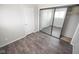 Bedroom with vinyl floors, sliding closet doors, and a single window at 2862 Punto Alto Ct, Indianapolis, IN 46227