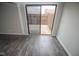 Living room with sliding glass doors to the patio and modern gray flooring at 2862 Punto Alto Ct, Indianapolis, IN 46227