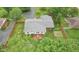 Overhead image of a home surrounded by lush trees and landscaping, highlighting the deck at 2910 S Sheridan Ave, Indianapolis, IN 46203