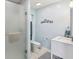 This bathroom features a toilet, a walk-in shower with a frosted glass door, and a vanity at 2910 S Sheridan Ave, Indianapolis, IN 46203
