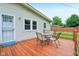 Outdoor deck with a table and chairs, offering a relaxing space for dining and entertaining at 2910 S Sheridan Ave, Indianapolis, IN 46203