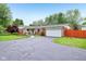 Charming brick ranch home with an attached two-car garage and beautiful landscaping at 2910 S Sheridan Ave, Indianapolis, IN 46203