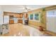 Kitchen with white appliances, oak cabinets, and a view to the back yard at 2910 S Sheridan Ave, Indianapolis, IN 46203