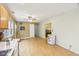 Eat-in kitchen features an exterior door, light wood flooring, and neutral paint at 2910 S Sheridan Ave, Indianapolis, IN 46203