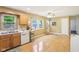 Kitchen with double sink, oak cabinets, and views to the back yard at 2910 S Sheridan Ave, Indianapolis, IN 46203