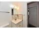 Bathroom featuring a vanity with a mosaic backsplash, wall lighting and a medicine cabinet at 3015 E Sumner Ave, Indianapolis, IN 46237