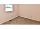 This bedroom features neutral walls, a window, and carpeted floors at 3015 E Sumner Ave, Indianapolis, IN 46237