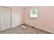 This bedroom features neutral walls, carpeted floors, and a closet at 3015 E Sumner Ave, Indianapolis, IN 46237