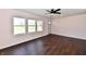 Bedroom featuring three windows and wood-look flooring at 3015 E Sumner Ave, Indianapolis, IN 46237
