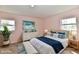 Primary bedroom featuring beach-themed artwork and white furniture at 3015 E Sumner Ave, Indianapolis, IN 46237