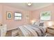 Bright bedroom with a neutral color palette, framed art, and plush bedding at 3015 E Sumner Ave, Indianapolis, IN 46237