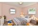 Bright bedroom with a neutral color palette, framed art, and plush bedding at 3015 E Sumner Ave, Indianapolis, IN 46237