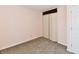 This bedroom features neutral walls, carpeted floors, and a closet at 3015 E Sumner Ave, Indianapolis, IN 46237