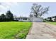Charming single-story home with a well-manicured lawn and an attached two car garage at 3015 E Sumner Ave, Indianapolis, IN 46237