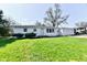 Charming single-story home with a well-manicured lawn and an attached two car garage at 3015 E Sumner Ave, Indianapolis, IN 46237