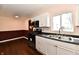 Kitchen with stainless appliances, ample counter space, updated cabinets, and a window at 3015 E Sumner Ave, Indianapolis, IN 46237