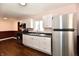 Spacious kitchen featuring stainless steel appliances, white cabinets, and modern fixtures at 3015 E Sumner Ave, Indianapolis, IN 46237