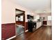 Bright kitchen featuring white cabinets, stainless steel appliances, and wood-look flooring at 3015 E Sumner Ave, Indianapolis, IN 46237