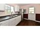 Bright kitchen featuring updated cabinets, stainless steel refrigerator, and a view from the window at 3015 E Sumner Ave, Indianapolis, IN 46237