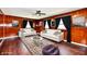 Cozy living room with wood paneling, white sofas, and stylish decor at 3015 E Sumner Ave, Indianapolis, IN 46237