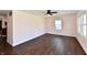 Spacious living room with hardwood floors, ceiling fan and an abundance of natural light at 3015 E Sumner Ave, Indianapolis, IN 46237