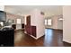 Open concept living room with wood-look flooring and ample natural light from multiple windows at 3015 E Sumner Ave, Indianapolis, IN 46237