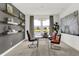A well-lit study featuring a sleek desk, comfortable seating, and shelving for decor at 3021 Vista View Dr, Greenwood, IN 46143