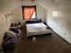 Bedroom in attic space with window and desk at 3070 N Layman Ave, Indianapolis, IN 46218