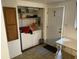 Laundry area with washer, dryer and storage shelving at 3070 N Layman Ave, Indianapolis, IN 46218