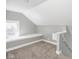 Finished attic space featuring carpeted floors, neutral paint, and a window seat at 317 E 37Th St, Indianapolis, IN 46205