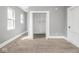 Bright bedroom featuring neutral walls, carpeted floors, and a closet at 317 E 37Th St, Indianapolis, IN 46205