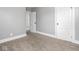 Bedroom featuring neutral carpet, grey walls, white trim and paneled doors at 317 E 37Th St, Indianapolis, IN 46205