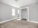 This bedroom features neutral walls, carpeted floors, and a closet at 317 E 37Th St, Indianapolis, IN 46205