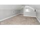 Bright bonus room with neutral carpet and a view to a second-story landing at 317 E 37Th St, Indianapolis, IN 46205