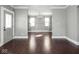 Open living room flowing into a dining space, highlighted by sleek hardwood floors at 317 E 37Th St, Indianapolis, IN 46205