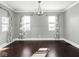 Bright living room with hardwood floors, neutral walls, and modern lighting at 317 E 37Th St, Indianapolis, IN 46205