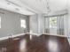 Spacious living area featuring hardwood floors, grey walls and natural lighting at 317 E 37Th St, Indianapolis, IN 46205