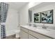 Modern bathroom featuring double sinks, a shower/tub, and decorative accents at 3326 Wetherby Pl, Danville, IN 46122