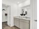 Stylish bathroom with double sinks, granite counters, modern cabinets, and a view to a walk-in closet at 3326 Wetherby Pl, Danville, IN 46122